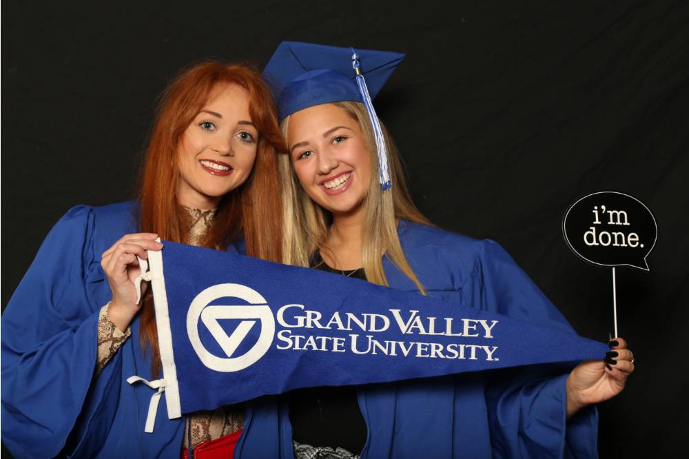 two women smiling at gradfest
